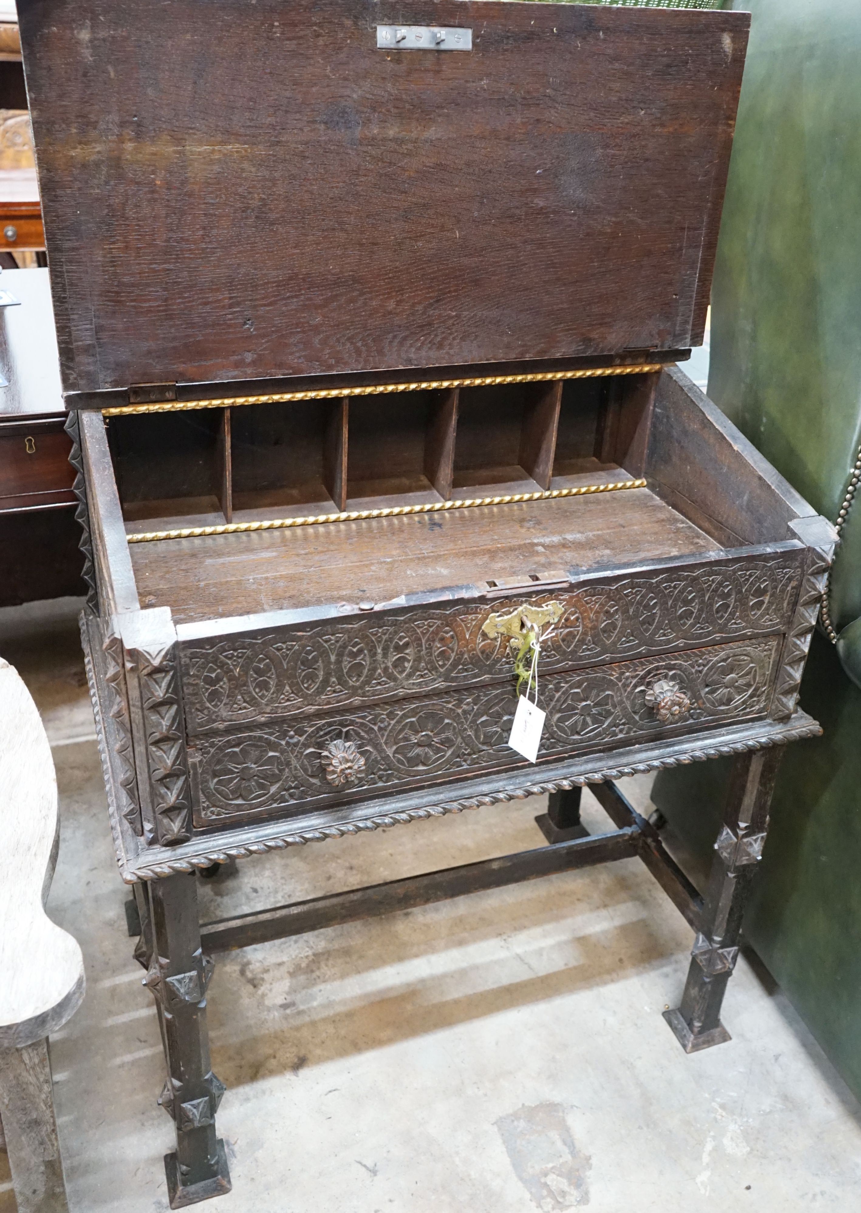 An Anglo-Indian carved oak desk, length 82cm, depth 53cm, height 103cm